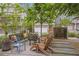 Inviting courtyard features seating, lush landscaping, and charming architectural details for relaxation and enjoyment at 392 Concord St, Alpharetta, GA 30009