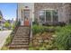 Inviting entrance with stone steps and wrought iron railing leading to a warm wooden door at 392 Concord St, Alpharetta, GA 30009