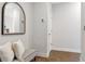 Inviting hallway with bench seating and a decorative mirror at 392 Concord St, Alpharetta, GA 30009