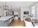 Spacious, open kitchen with large island that flows to dining area and living area at 392 Concord St, Alpharetta, GA 30009