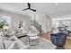 Spacious living area with modern decor, staircase, and open floor plan at 392 Concord St, Alpharetta, GA 30009