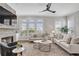 Bright living room showcasing neutral tones, two sofas, and large windows with plantation shutters at 392 Concord St, Alpharetta, GA 30009