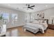Serene main bedroom features hardwood floors, plantation shutters, and a ceiling fan at 392 Concord St, Alpharetta, GA 30009