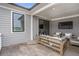 Covered patio with outdoor seating and TV, perfect for relaxing and entertaining at 392 Concord St, Alpharetta, GA 30009