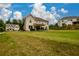 Expansive backyard showcasing the patio and ample green space, perfect for outdoor living at 4832 Stone Way Path, Buford, GA 30519