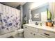 Bathroom featuring a vanity, plant accents, and a shower with a floral curtain at 4832 Stone Way Path, Buford, GA 30519