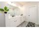Bright bathroom featuring a double sink vanity with modern fixtures and plenty of storage at 4832 Stone Way Path, Buford, GA 30519