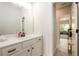 Bathroom vanity with white cabinets, drawers and black hardware at 4832 Stone Way Path, Buford, GA 30519