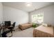 Bright bedroom featuring two beds and a work space with a computer at 4832 Stone Way Path, Buford, GA 30519