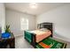Well-lit bedroom with unique decor and comfortable bed at 4832 Stone Way Path, Buford, GA 30519