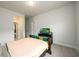 Bedroom with neutral paint, simple furnishings, and bright natural lighting at 4832 Stone Way Path, Buford, GA 30519