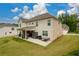 Elevated view of the backyard, featuring the patio and well-maintained lawn at 4832 Stone Way Path, Buford, GA 30519