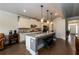 Bright and open kitchen featuring an island with seating and white cabinets at 4832 Stone Way Path, Buford, GA 30519