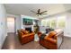 Bright living room featuring a fireplace, hardwood floors, and comfortable seating at 4832 Stone Way Path, Buford, GA 30519