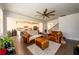 Open-concept living room with hardwood floors and view of the kitchen at 4832 Stone Way Path, Buford, GA 30519