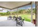 Enjoy outdoor relaxation on the covered patio with views of the expansive backyard at 4832 Stone Way Path, Buford, GA 30519