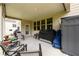 Spacious covered patio featuring a grill and storage, perfect for outdoor entertaining at 4832 Stone Way Path, Buford, GA 30519