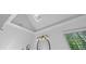 Bright bathroom with skylight, updated mirror, and crown moulding at 763 Old Paper Mill Se Dr, Marietta, GA 30067