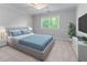 Cozy bedroom featuring a serene atmosphere, large windows, and modern decor at 763 Old Paper Mill Se Dr, Marietta, GA 30067