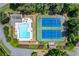 Aerial view of a community pool and tennis courts, perfect for recreation and social activities at 763 Old Paper Mill Se Dr, Marietta, GA 30067