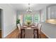 Dining room with wood floors and natural light at 763 Old Paper Mill Se Dr, Marietta, GA 30067