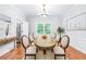 Formal dining room with a chandelier, hardwood floors, and a window with views of the outdoors at 763 Old Paper Mill Se Dr, Marietta, GA 30067