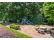 Neighborhood playground with a slide, swings, and picnic tables, perfect for Gathering fun and recreation at 763 Old Paper Mill Se Dr, Marietta, GA 30067