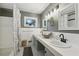 Bright bathroom features dual sinks, neutral color scheme, and decorative tile flooring at 112 Pioneer Trail, Cartersville, GA 30121