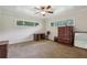 Comfortable bedroom featuring a ceiling fan, carpet, and natural light at 112 Pioneer Trail, Cartersville, GA 30121