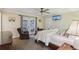 Cozy bedroom with carpet, ceiling fan, access to outdoor patio and television at 112 Pioneer Trail, Cartersville, GA 30121