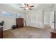 Bedroom showcasing carpet, a ceiling fan, and closet space at 112 Pioneer Trail, Cartersville, GA 30121