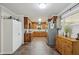 Classic kitchen featuring wooden cabinets and drawers and stainless steel appliances at 112 Pioneer Trail, Cartersville, GA 30121