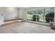 Bright living room with neutral carpet, large windows offer great view and ample sunlight at 112 Pioneer Trail, Cartersville, GA 30121