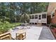 Outdoor patio with seating area and view of screened porch and backyard at 112 Pioneer Trail, Cartersville, GA 30121