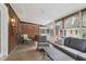 Relaxing screened porch offering comfortable seating, ceiling fan, and wooded views at 112 Pioneer Trail, Cartersville, GA 30121