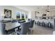 Stylish dining area adjacent to modern open-concept kitchen at 1725 Lansmere Sw St, Marietta, GA 30008