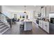 Kitchen boasts stainless steel appliances, sleek white cabinets, an island, and barstool seating at 1725 Lansmere Sw St, Marietta, GA 30008