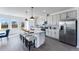 Modern kitchen with stainless steel appliances, white cabinets, an island, and barstool seating at 1725 Lansmere Sw St, Marietta, GA 30008