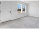 Bright living room with neutral carpet and natural light at 1725 Lansmere Sw St, Marietta, GA 30008