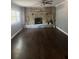 Cozy living room with hardwood floors and a stone fireplace at 2030 Carr Rd, Conyers, GA 30012