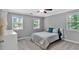 Cozy bedroom with two windows, a ceiling fan and a dresser at 2766 Stonecreek Se Rd, Smyrna, GA 30080