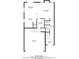 This floor plan shows the first floor which includes a kitchen, dining area, living room, and garage at 2766 Stonecreek Se Rd, Smyrna, GA 30080