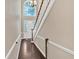 Foyer with stained wood floors, and high ceilings, a pendant chandelier, and a beautifully decorated front door at 2766 Stonecreek Se Rd, Smyrna, GA 30080