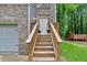 Close up view of the front door, with flower boxes and a wood porch and stairway at 2766 Stonecreek Se Rd, Smyrna, GA 30080