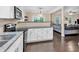 Open concept kitchen overlooking the living room, featuring granite countertops and stainless appliances at 2766 Stonecreek Se Rd, Smyrna, GA 30080