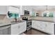 Lovely kitchen featuring white cabinets, stainless steel appliances, and granite countertops at 2766 Stonecreek Se Rd, Smyrna, GA 30080