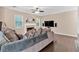 Neutral living room featuring a fireplace, ceiling fan, and hardwood floors with large comfortable couches at 2766 Stonecreek Se Rd, Smyrna, GA 30080