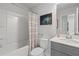 Bright bathroom featuring a clean design with white countertops and tiled shower at 3142 Washburn St, Atlanta, GA 30354