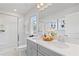 Beautiful bathroom with double sinks, sleek vanity, and a glass-enclosed shower at 3142 Washburn St, Atlanta, GA 30354