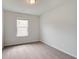 Bright bedroom features plush carpeting, a window providing natural light, and neutral paint, creating a serene atmosphere at 3142 Washburn St, Atlanta, GA 30354